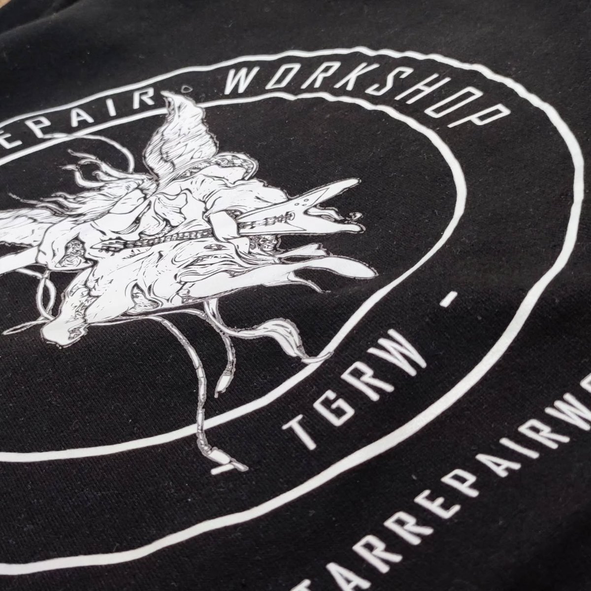 The Guitar Repair Workshop staff hoodie detail